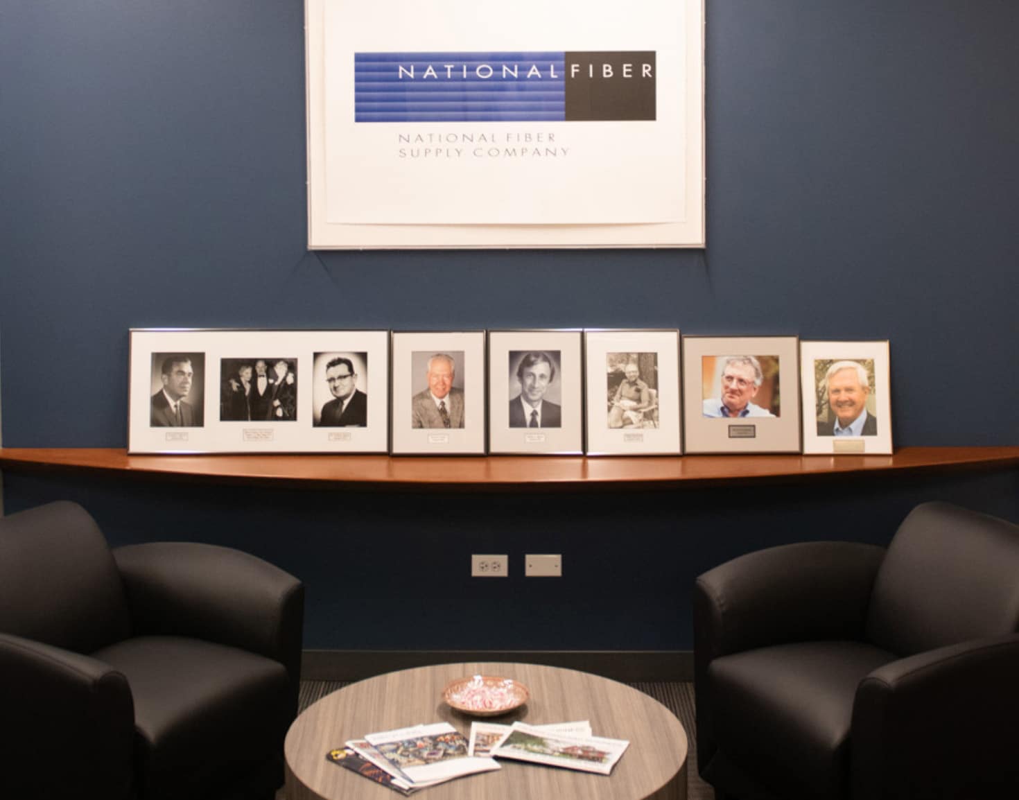 NFS history plaques with two lounge chairs in front of them
